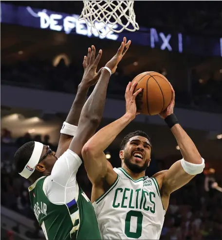  ?? GETTY IMAGES ?? BRINGING IT BACK HOME: Jayson Tatum goes up for a shot against Milwaukee’s Bobby Portis in the Celtics’ Game 6 win on Friday night.