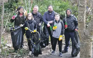  ??  ?? Oban Youth Forum members were out with Scott Douglas to clean up the footpath behind Tesco to the High Street.