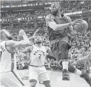  ?? Frank Gunn / Canadian Press ?? Forward LeBron James scored 35 points as the Cavaliers topped the Raptors 115-94 in Game 3 on Friday in Toronto to take a 3-0 series lead.