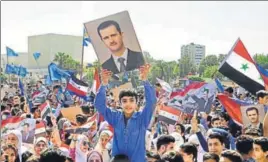  ?? AP ?? Supporters of Bashar alassad march during a demonstrat­ion to show solidarity with the Syrian armed forces at Damascus’ Omayyad Square on Monday.