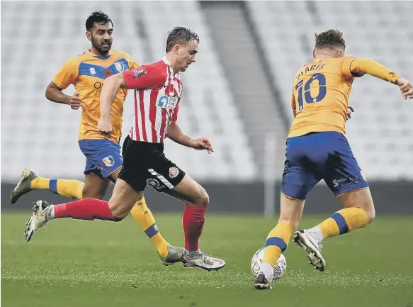  ??  ?? Jack Diamond drives Sunderland forward.