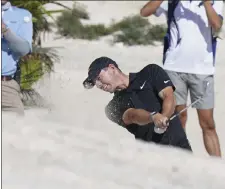  ?? AP ?? Rory Mcilroy hits out of a bunker on the fifth hole during the first round of the Hero World Challenge on Thursday.