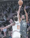  ?? Mary Altaffer ?? The Associated Press Warriors forward Kevin Durant shoots over Knicks guard Frank Ntilikina in the first half of Golden State’s 128-100 win Friday at Madison Square Garden.