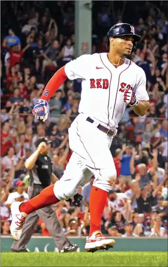  ?? STUART CAHILL / HERALD STAFF FILE ?? HOMEGROWN TALENT: Shortstop Xander Bogaerts rounds the bases on his solo home run against the Rangers at Fenway Park on Aug. 20.