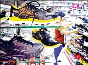  ?? HONG MENEA ?? The Kingdom exported $1.05 billion worth of ‘footwear, socks, related products and parts thereof’ in the January-July period, up by 33.8 per cent year-on-year.