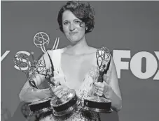  ?? — Reuters photo ?? Waller-Bridge poses backstage with her awards.