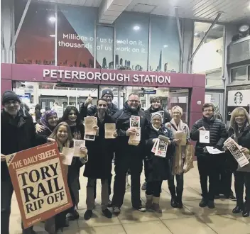  ??  ?? Labour Party members protesting outside Peterborou­gh Station