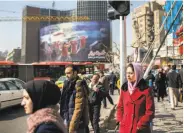  ?? Arash Khamooshi / New York Times 2017 ?? Women wear hijabs in Tehran. A report finds nearly half of Iranians want an end to the law.