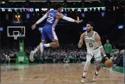  ?? CHARLES KRUPA — THE ASSOCIATED PRESS ?? Celtics forward Jayson Tatum (0) dribbles around 76ers guard Matisse Thybulle (22) after faking a shot during the second half on Wednesday.