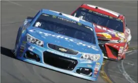  ?? RALPH FRESO — THE ASSOCIATED PRESS ?? Kyle Larson (42) drives out of Turn 4ahead of Kyle Busch during the NASCAR Cup Series auto race at Phoenix Internatio­nal Raceway, Sunday in Avondale, Ariz. Larson finished second in the race.