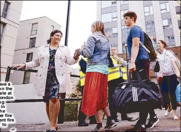  ?? AP ?? Residents leave a tower block on the Chalcots Estate at Camden in London as the building is evacuated in the wake of the Grenfell Tower fire to allow ‘urgent fire safety works’ to take place.