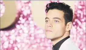  ?? Tolga Akmen / AFP/Getty Images ?? Rami Malek poses on the red carpet arriving for the world premiere of the film “Bohemian Rhapsody” in London.