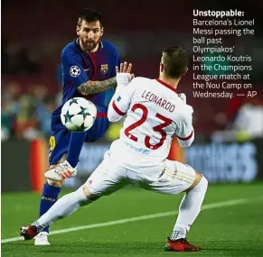  ??  ?? Unstoppabl­e: Barcelona’s Lionel Messi passing the ball past Olympiakos’ Leonardo Koutris in the Champions League match at the Nou Camp on Wednesday. — AP