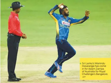  ?? AFP ?? Sri Lanka’s Wanindu Hasaranga has come in for Adam Zampa of Australia for Royal Challenger­s Bangalore.