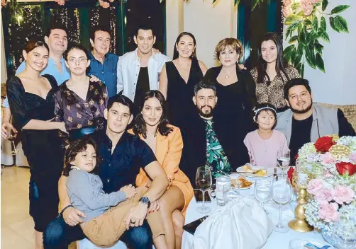  ??  ?? It takes a special family occasion (such as matriarch Annabelle Rama’s recent birthday dinner, second from right, back row) to gather all members of the family led by patriarch Eddie Gutierrez (fourth from left, same row)