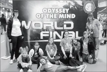  ?? LOANED PHOTO ?? MELISSA REESE, DAISY BOELTS, Devlyn Reese, Jasmine Gaona (on floor) Taeler Collum (next to Devlyn), Rosaline Pond, Kristin Mitchell, Matthew Boelts and parent Alicia Boelts attend the Odyssey of the Mind World Finals in Michigan over the weekend.