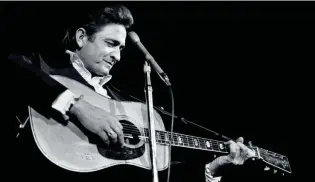  ?? JACK CORN / THE TENNESSEAN ?? Leading artist Johnny Cash performs during the Columbia Records show at the Municipal Auditorium on Oct. 18, 1969.