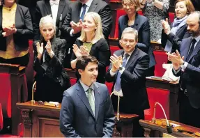  ?? — THE ASSOCIATED PRESS FILES ?? Canadian Prime Minister Justin Trudeau acknowledg­es applause from lawmakers at the end of his speech at the French National Assembly in Paris on Tuesday.