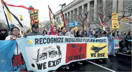  ?? THE ASSOCIATED PRESS FILES ?? Native groups march toward the White House in Washington on March 10 to rally against the disputed Dakota Access pipeline. Tribes representi­ng tens of thousands of indigenous people on both sides of the U.S.-Canada border are signing a declaratio­n...