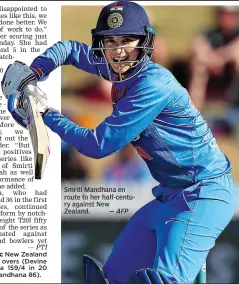  ?? — AFP ?? Smriti Mandhana en route to her half- century against New Zealand.