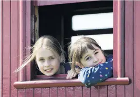  ??  ?? A holiday adventure . . . Enjoying the Ocean Beach Railway experience are sisters Jade Anderson (11, left) and Opal Anderson (9), visiting from Queenstown.