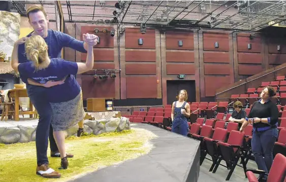  ??  ?? Danny Gavigan, who plays Gerry, and Annie Grier, who plays Agnes, practice their dance scene at the Everyman Theatre production of “Dancing At Lughnasa” by Brian Friel.