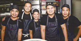  ??  ?? Chef Joseph Margate (second from left) with the hardworkin­g kitchen team (from left) sous chef Robert Caube, Danica Manuel, Mar Janssen Montenegro and Mark Lauro.