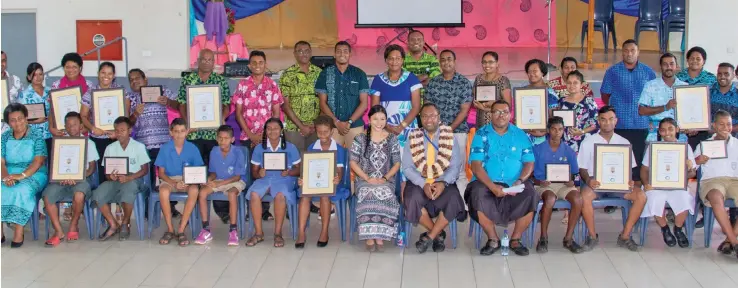  ??  ?? Sub-divisional Medical Officer Macuata, Dr Tiko Saumalua (seated with garland) with students, teachers and stakeholde­rs of the Health Promoting Schools programme.