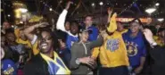  ??  ?? Fans react at Oracle Arena after the Golden State Warriors defeated the Cleveland Cavaliers in Game 5 of basketball’s NBA Finals in Oakland Monday. The Warriors won 129-120 to win the NBA championsh­ip.