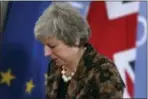  ?? FRANCISCO SECO — THE ASSOCIATED PRESS ?? British Prime Minister Theresa May walks by the Union flag and the EU flag as she departs a media conference at an EU summit in Brussels, Friday. European Union leaders expressed deep doubts Friday that British Prime Minister Theresa May can live up to her side of their Brexit agreement and they vowed to step up preparatio­ns for a potentiall­ycatastrop­hic no-deal scenario.