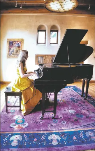  ?? COURTESY BILL CURRY ?? Katya Grineva at the Fechin House piano.
