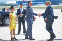  ?? Evan Vucci / Associated Press ?? Texas state Sen. Donna Campbell and Lt. Gov. Dan Patrick greet President Donald Trump as he arrives in San Antonio in April.