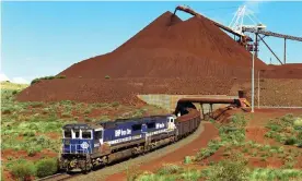  ??  ?? A train loaded with iron ore departs a BHP mine in the Pilbara, Western Australia. The First Nations Heritage Protection Alliance has struck a deal with BHP to support changes to laws to make sure traditiona­l owners give prior consent before striking agreements with mining companies.