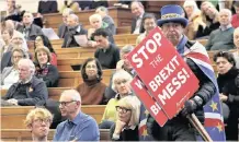  ??  ?? A DEMONSTRAT­OR enters the emergency public gathering “Think Anew, Act Anew”, a convention on Brexit and a People’s Vote, in London on Friday, ahead of the big parliament­ary debate on the UK and the EU tomorrow. | AP