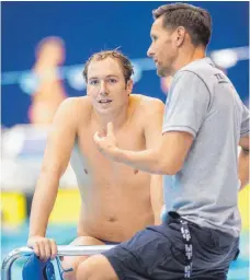  ?? FOTO: DPA ?? Neues Tandem: Henning Lambertz (re.), Cheftraine­r des Deutschen Schwimm-Verbandes, und Marco Koch.
