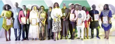  ?? PHOTOS: ?? Group photograph of award winners during the 18th Wole Soyinka awards for investigat­ive reporting in Abuja yesterday Onyekachuk­wu Obi