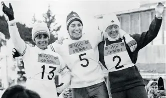  ?? GETTY IMAGES/FILES ?? French skiers Annie Famose, left, and Marielle Goitschel and Canadian Nancy Greene celebrate after their slalom race in Chamrousse, France, at the 1968 Winter Olympic Games.