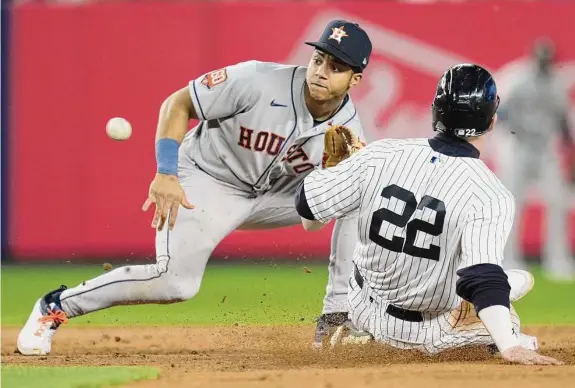  ?? Brett Coomer/Staff photograph­er ?? Astros shortstop Jeremy Peña tags out Harrison Bader trying to steal second base in the fifth inning of Game 3 of the ALCS on Saturday at Yankee Stadium.