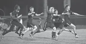  ?? CHET PETERMAN/SPECIAL TO THE POST ?? Royal Palm Beach soccer players rush the field after a goal scored by Sebastian Montes during the Wildcats’ district semifinal victory over Wellington on Jan. 26.