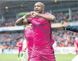  ??  ?? William Edjenguele celebrates scoring the second for United.