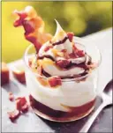  ?? Noel Barnhurst Associated Press ?? Bacon abounds in
Burger King’s new sundae. It
debuts Thursday with several
pork, beef and chicken sandwiches, including a
Memphis Pulled Pork
BBQ Sandwich.