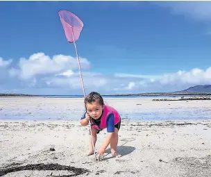  ??  ?? ●● Four-year-old Aoife, Joanie’s youngest, at Moyrus Strand