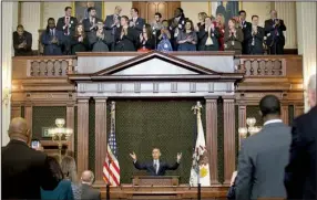  ?? AP/PABLO MARTINEZ MONSIVAIS ?? The Illinois General Assembly gives President Barack Obama a standing ovation Wednesday in Springfiel­d before he addressed the lawmakers in the chamber where he began his national political career. In his speech, Obama appealed for help to rid politics...