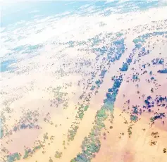  ??  ?? This aerial handout photo received from Attapeu Today shows floodwater­s across Attapeu province after a dam collapsed. — AFP photos