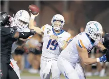  ?? JOHN LOCHER/AP ?? Quarterbac­k Hank Bachmeier has helped Boise State go to 5-0 and move up to No. 14 in the AP Top 25 poll.