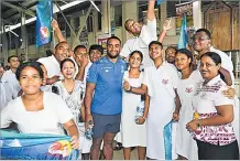  ?? Picture: REINAL CHAND ?? Fijian Drua flyhalf Kemu Valetini with students at Tilak High School in Lautoka.
