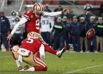  ?? AP PHOTO/TONY AVELAR ?? In this 2018 file photo, San Francisco 49ers kicker Robbie Gould (9) kicks a field goal from the hold of Bradley Pinion during overtime of an NFL football game to defeat the Seattle Seahawks in Santa Clara, Calif.