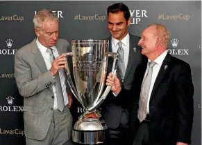  ??  ?? McEnroe joins fellow tennis greats Rod Laver and Roger Federer at the unveiling of the Laver Cup at this year’s Wimbledon.