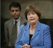  ?? BILL HABER - ASSOCIATED PRESS ?? In this 2009 file photo, former Louisiana Gov. Kathleen Blanco address a news conference as Gov. Bobby Jindal looks on at the state capitol in Baton Rouge, La.