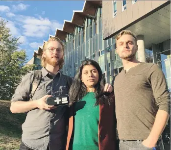  ??  ?? UBC Alma Matter Society vice co-ordinator Alex Dauncey, left, student services manager Marium Hamid and president Alan Ehrenholz display a naloxone kit outside the student-union building at the University of B.C.